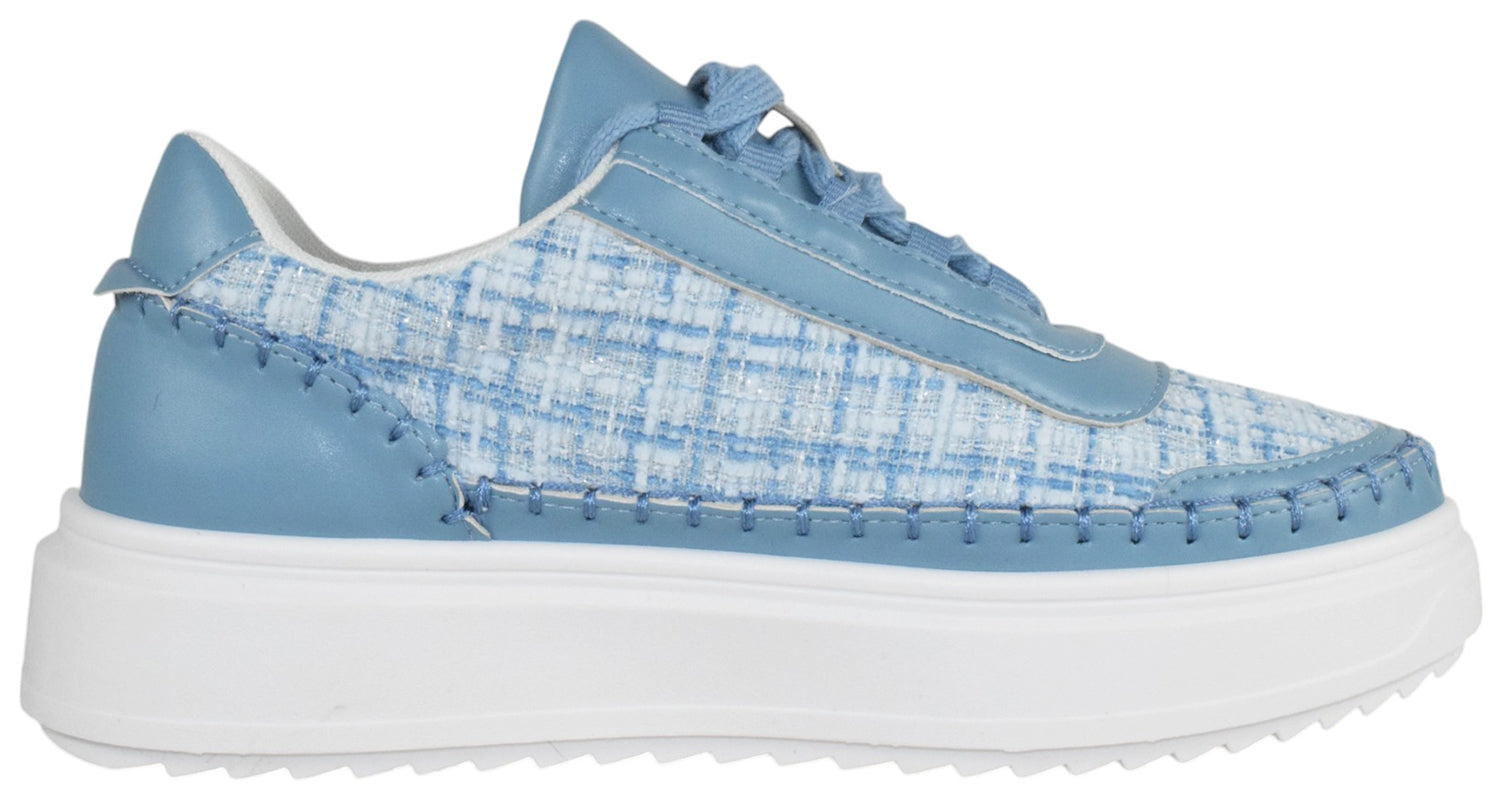 Blue sneaker with a white sole on a white background